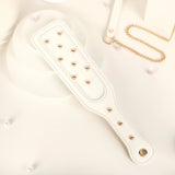 Paddle clouté blanc du kit bondage | BDSM Empire