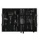 Kit Dominatrice Minuit : pochette ouverte, pièces rangées, noir